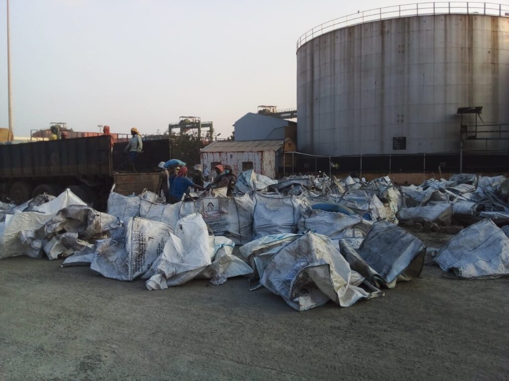 UNOADING CEMENT BAGS FROM TIPPER