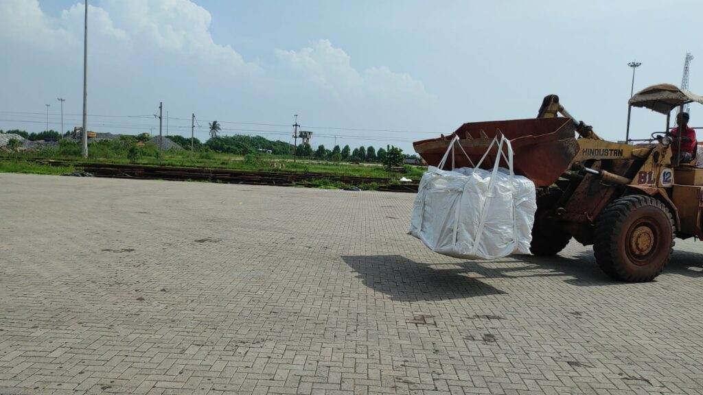 cement bags carried by pay loader